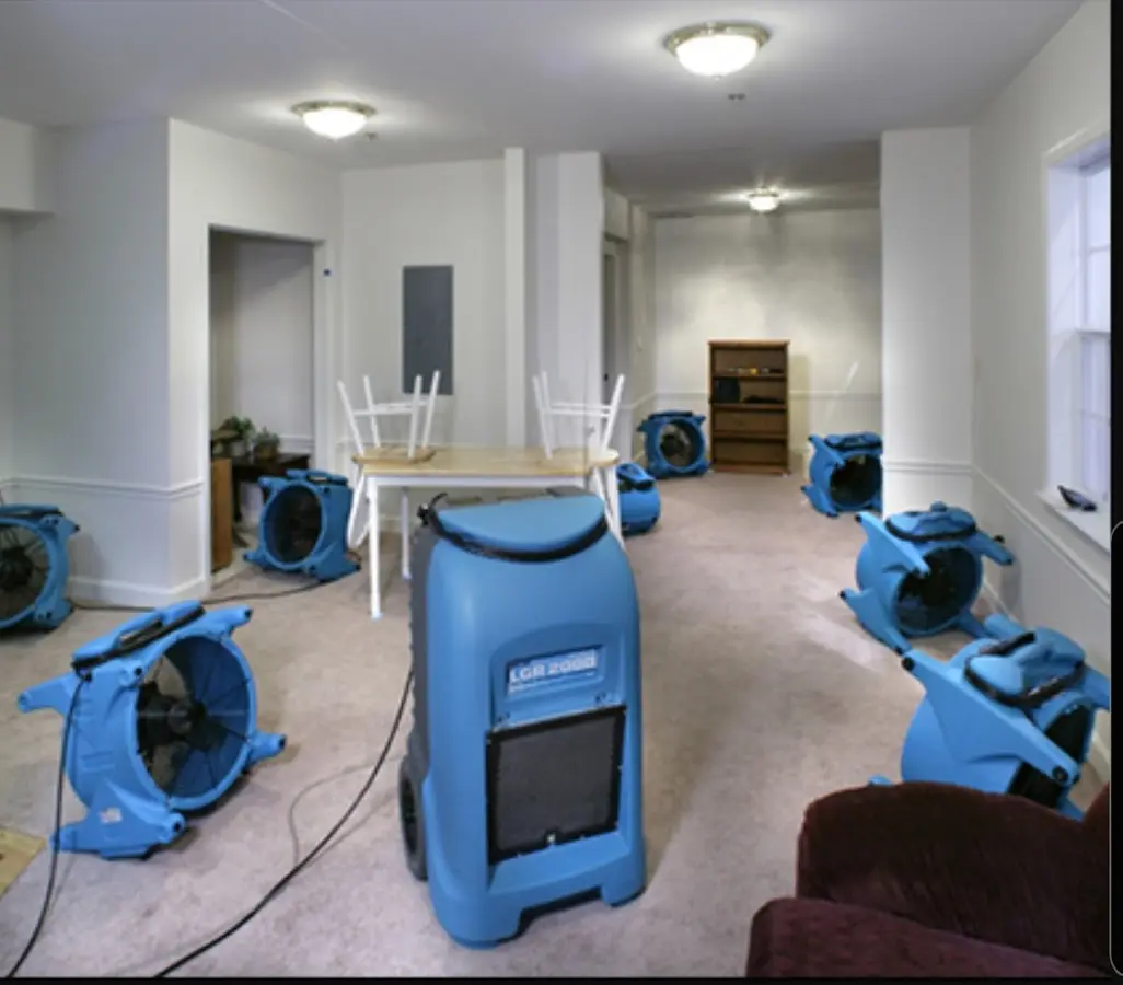 Air movers and dehumidifier setup for Water Extraction & Removal in Tichigan